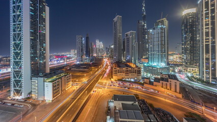 Fototapeta na wymiar Aerial panoramic view of Dubai Downtown skyline with many towers day to night timelapse.