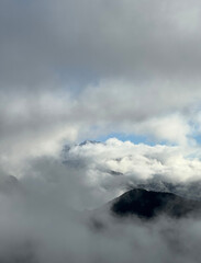 mountain landscape with low clouds and fog