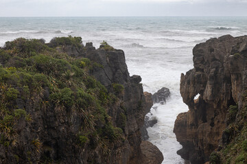 pancake rocks with sea in the background