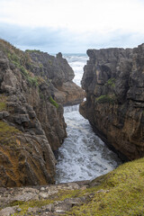 pancake rocks with sea in the background