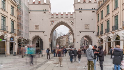 Naklejka premium Karlstor in the old town of Munich timelapse with unidentified people walking on the street. Germany
