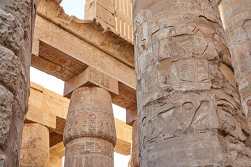 Famous ancient Karnak Temple complex, Luxor, Egypt. Ancient ruins of Karnak temple in Luxor. Egypt. Great Hypostyle Hall at the Temples of Karnak (ancient Thebes). - obrazy, fototapety, plakaty