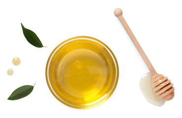 Tasty honey in bowl, dipper and green leaves on white background, flat lay