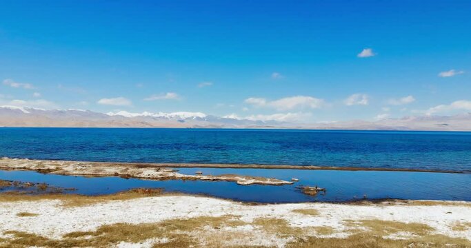 The high and beautiful Sarez Lake is located in the Pamir Mountains. High crusts around the lake. Central Asia. Pimir. Tajikistan. Road trip in Tajikistan.