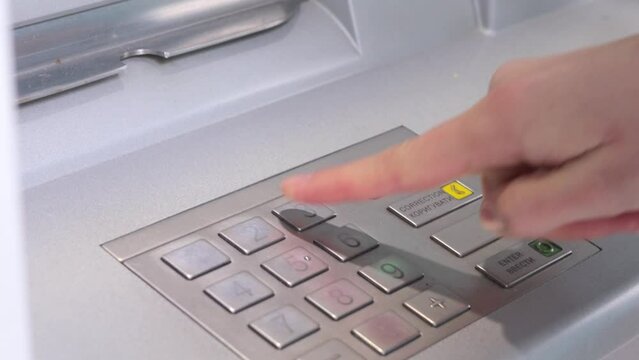 Automated financial services. Currency deposit procedures. Electronic banking convenience. ATM PIN code security. Financial account management. Unrecognizable woman pressing ATM EPP keyboard