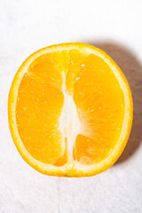 fresh orange in the cut closeup, vertical