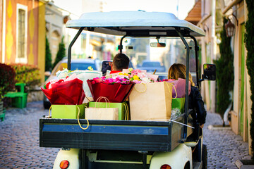 Man Driving Golf Cart With Bags