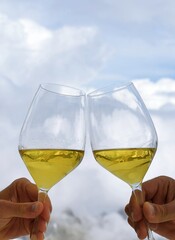 Toast with two glasses of white wine on the Mont Blanc glacier