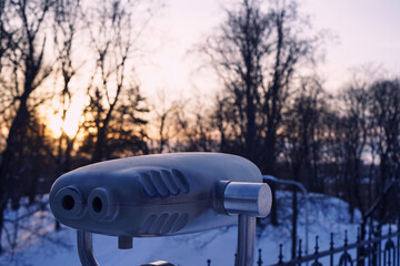 Coin Operated Binoculars on the Background of Winter Landscape
