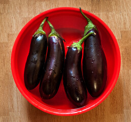 eggplants in a bowl of water, preparation for cooking vegetables