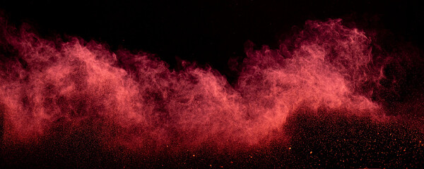 Red powder dust smoke on black background