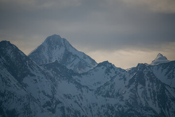wonderful view to the summit of the kitzsteinhorn at a warm, cloudy and sunny winter day -holidays...
