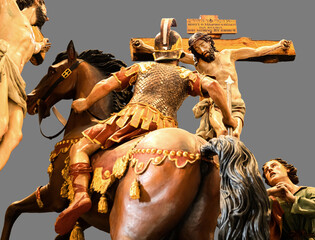 Polychrome wood carvings of the Calvary of Christ with the spear that will be stuck in his chest....