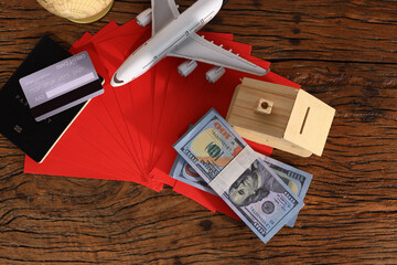 Business Finance concept, Cash  Red envelope  Credit card and passport model. Travel on Chinese new year