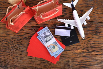 Business Finance concept, Cash  Red envelope  Credit card and passport model. Travel on Chinese new year