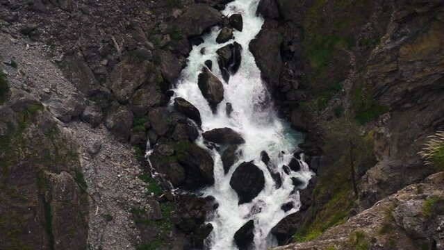 Aerial view of the deep gorge under the zipline in the canyon of Pre-Saint-Didier park, Aosta, Italy 