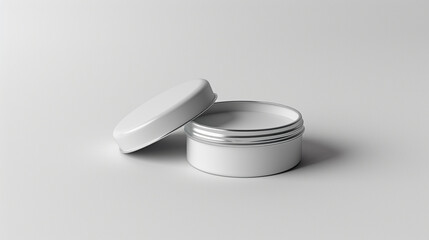 a blank gray lip balm tin on a solid white background, with a lid and a balm effect. 