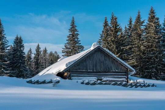 A summer farm barn of the Totenaasen Hills, Norway, in winter.