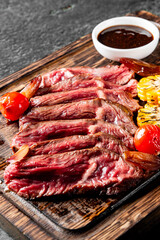 Cooked sliced beef steak rare with sauce