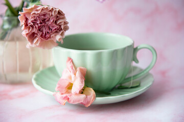 cup of coffee and pink flowers