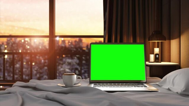 Laptop with replaceable chroma key screen in apartment bedroom before wide window with winter cityscape, looped footage
