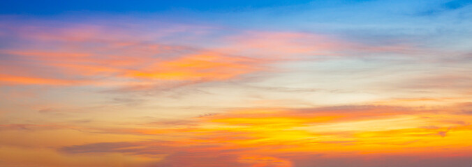 Beautiful Vivid sky painted by the sun leaving bright golden shades.Dense clouds in twilight sky in...