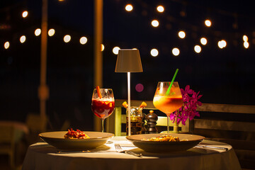 beachside dinner table,Beachside dinner table with one large challah, two bottles of red wine, two...