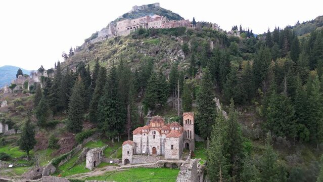 Mystras or Mistras, also known in the Chronicle of the Morea as Myzethras or Myzithras, is a fortified town and a former municipality in Laconia, Peloponnese, Greece. Ruines drone aerial view 