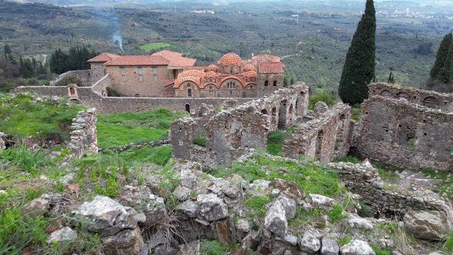 Mystras or Mistras, also known in the Chronicle of the Morea as Myzethras or Myzithras, is a fortified town and a former municipality in Laconia, Peloponnese, Greece. Ruines drone aerial view 