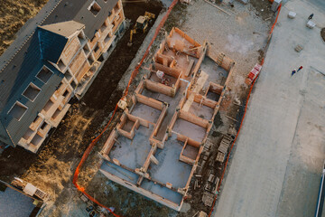 Fototapeta na wymiar Aerial view of a new development area. Construction site. Cement and bricks structures