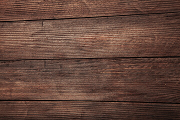 Vintage brown wood background texture with knots and nail holes. Old painted wood wall. Brown abstract background. Vintage wooden dark horizontal boards. Front view with copy space