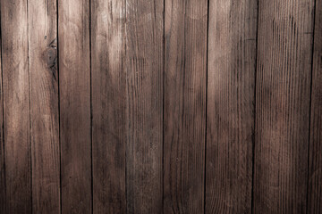 Vintage brown wood background texture with knots and nail holes. Old painted wood wall. Brown abstract background. Vintage wooden dark horizontal boards. Front view with copy space
