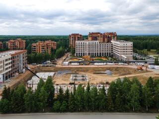 Fototapeta na wymiar the construction site of an apartment building in the summer from a height