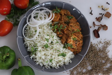 Jeera Bhaat or Jeera Rice served with paneer masala curry.