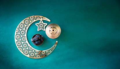 Flatly image of crescent moon with dates and lantern lamp, 2024 Ramadan Kareem and Eid Mubarak...