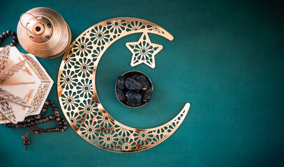 Ramadan Kareem New Poster background, Golden colour crescent moon with dates and lantern lamp isolated on dark green colour background