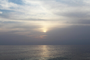 Naklejka na ściany i meble natural background sunset over the sea