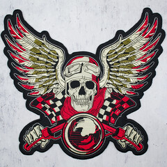 Embroidered patch Skull of a biker in helmet and with wings. Engine pistons Ride. Accessory for...