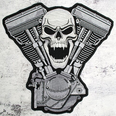 The embroidered patch. Attributes for bikers, rockers and metalheads. Engine with Skull.