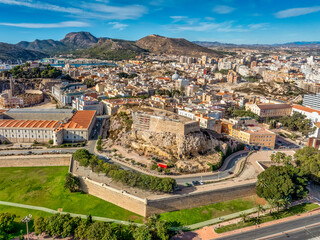Aerial view of Cartagena port city in Spain surrounded by bastions and fortifications, medieval...