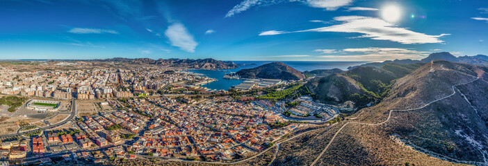 Aerial view of Cartagena port city in Spain surrounded by bastions and fortifications, medieval...