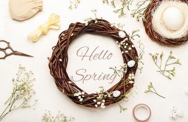 Banner with text HELLO SPRING and Easter wreath