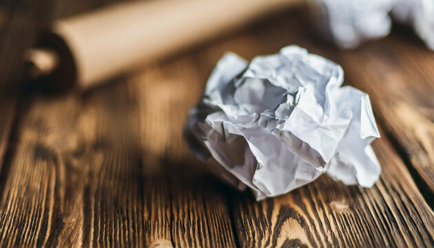 Crumpled white paper symbolizing creativity, ideas, and potential, isolated on rustic background