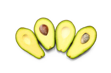 Halves of tasty ripe avocados on white background
