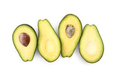 Halves of tasty ripe avocados on white background