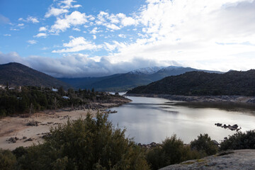 Naklejka na ściany i meble Spain landscape with lake on a cloudy spring day