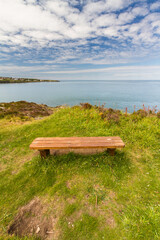 North Coast of Anglesey, Wales, bench to sit and look at Irish Sea. - 731219926