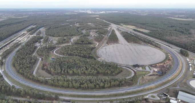 Birds eye view on a test track for road vehicles. Multi purpose test facilities, from special surfaces of road, to high speeds straightaway
