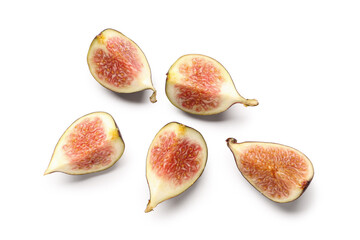 Pieces of fresh ripe figs on white background