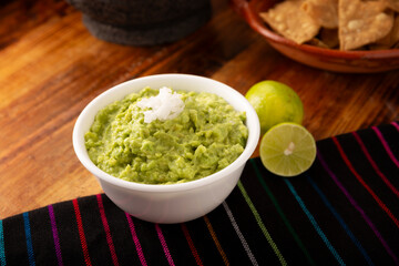 Guacamole. Avocado dip sauce, one of its many ways of consuming it is spread on tortilla chips also called Nachos. Mexican easy homemade sauce recipe very popular.